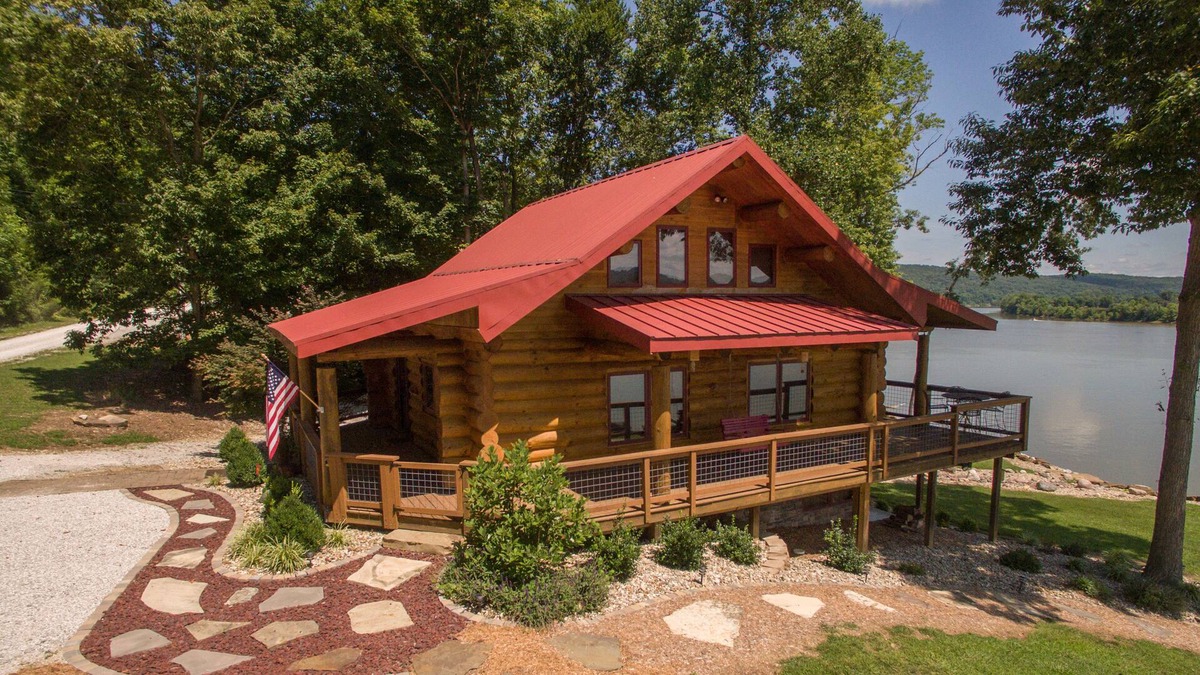 Magnet Cabin | Come sit, relax and unwind on the covered wraparound deck along the River.