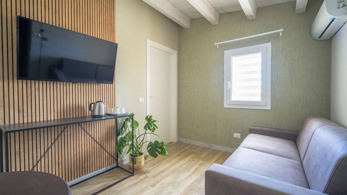 Tresauro Condo | Comfortable room with sofa bed and suitable for 4 people