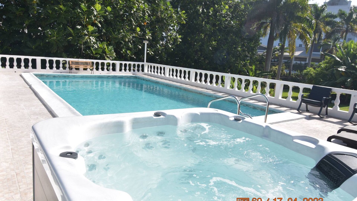 Mammee Bay Villa | Comfy bedrooms minutes away from beach, free WIFI, spa hut, BBQ,24-hour security