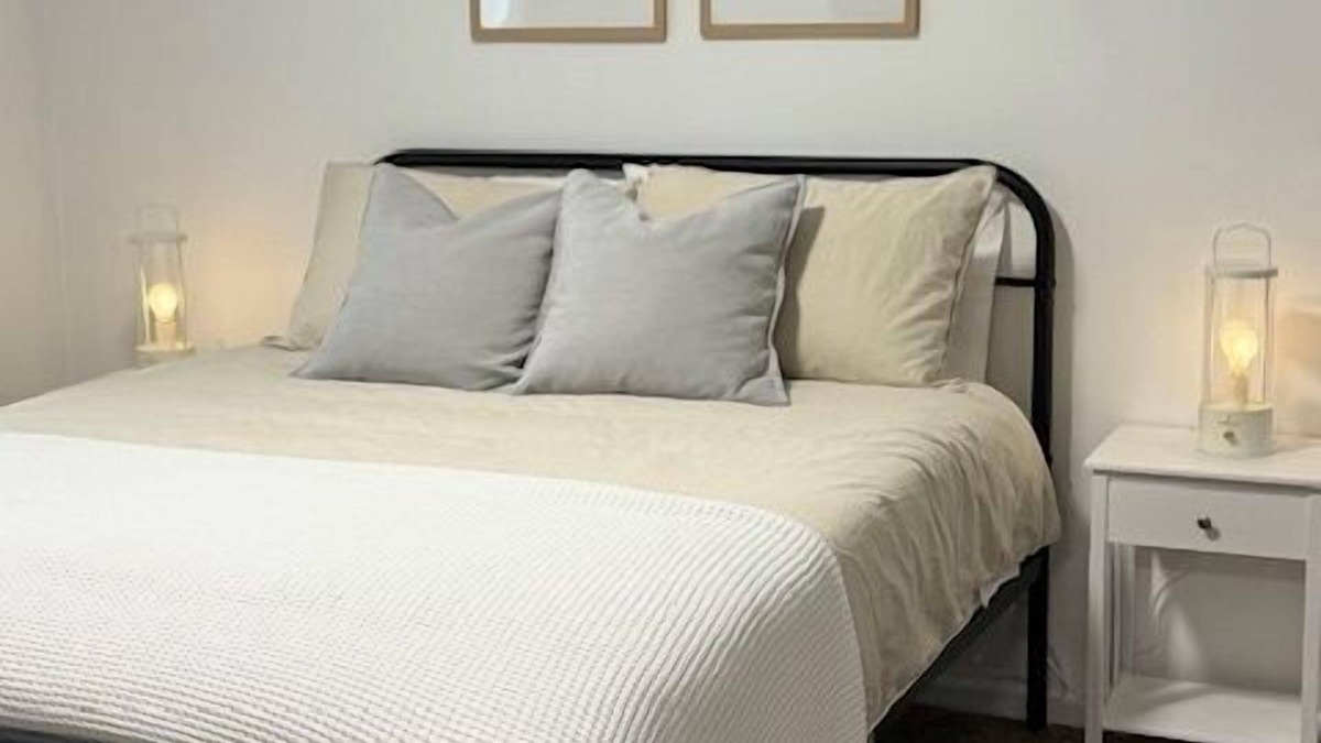 Rock Springs House | Completely Renovated home comfortably accommodates your stay with a queen bed in the primary bedroom, a twin bed with a pull-out trundle in the second bedroom, and a sleeper sofa in the living room for additional guests.