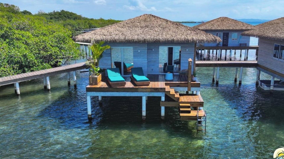 Isla Solarte House | Coral Reef Over Water Bungalow, Bedroom, King Bed, Living Room, Kitchenette