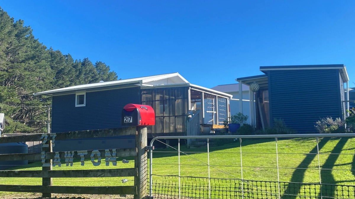 Kawhia Cottage | Cosy Aotea Cottage with water views, a gentle stroll to the beach. Pet Friendly!