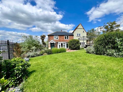 Layer Marney House | Cosy Coastal 2-Bedroom Cottage with Hot Tub and Log Burner