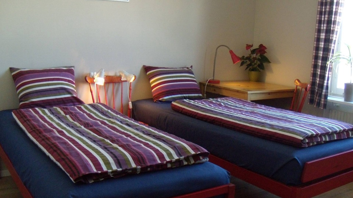 Umea House | Cosy guest room with private guest bathroom