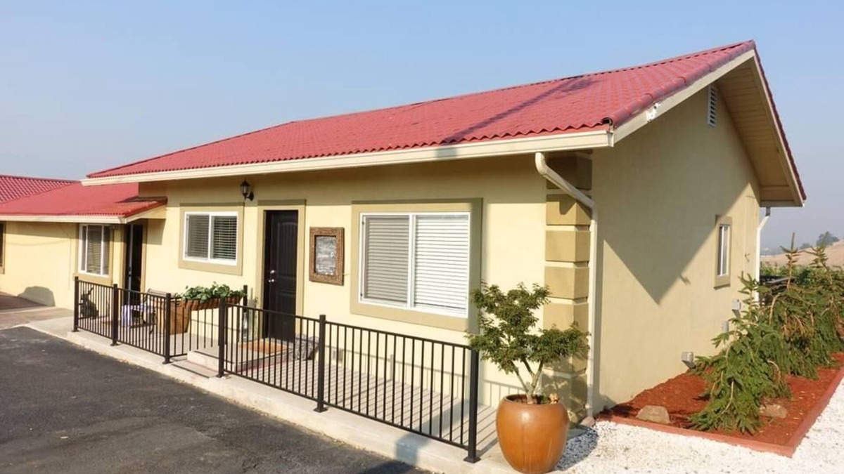 Talent Apartment | Cottage 1 offers a king-sized bed, dining area, full kitchen, hot tub.