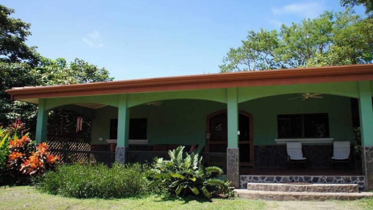 Junquillal House | Cozy 3-bedroom retreat in Tierra Pacifica with lush gardens, AC, hammock rancho, and full access to pool, gym, yoga room, and more.