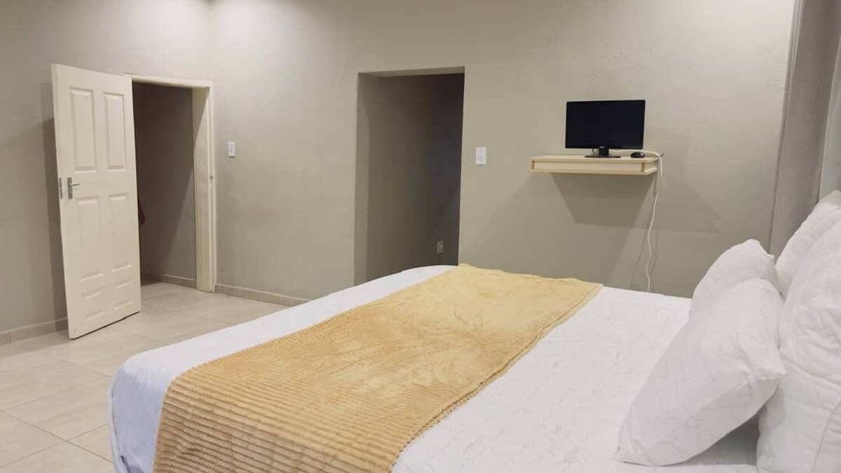 Matsapha House | Cozy bedroom ensuite, fully equipped retreat.