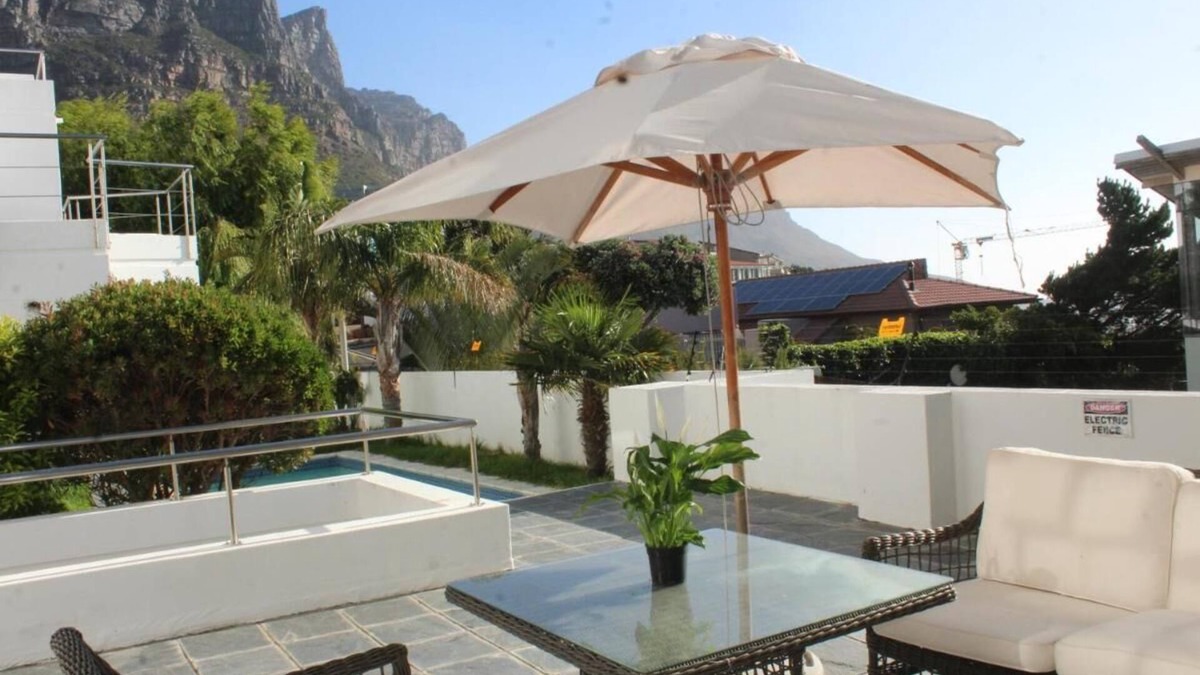 Camps Bay Ski Chalet | Cozy Camps Bay House with mountain and sea view