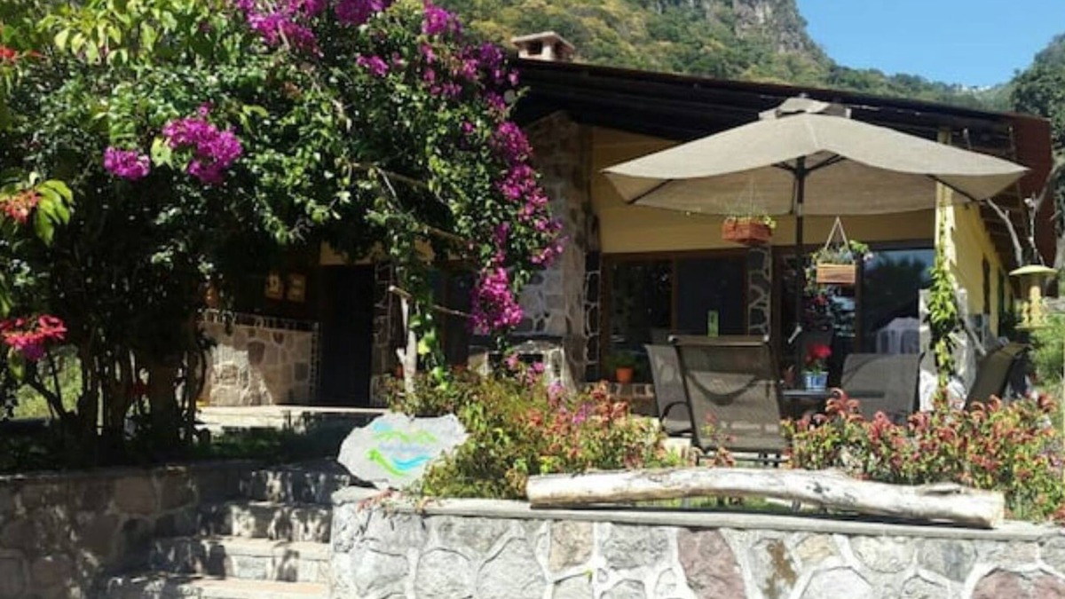 Panajachel Cottage | Cozy country cottage with wooden ceilings and stone walls within nature reserve.