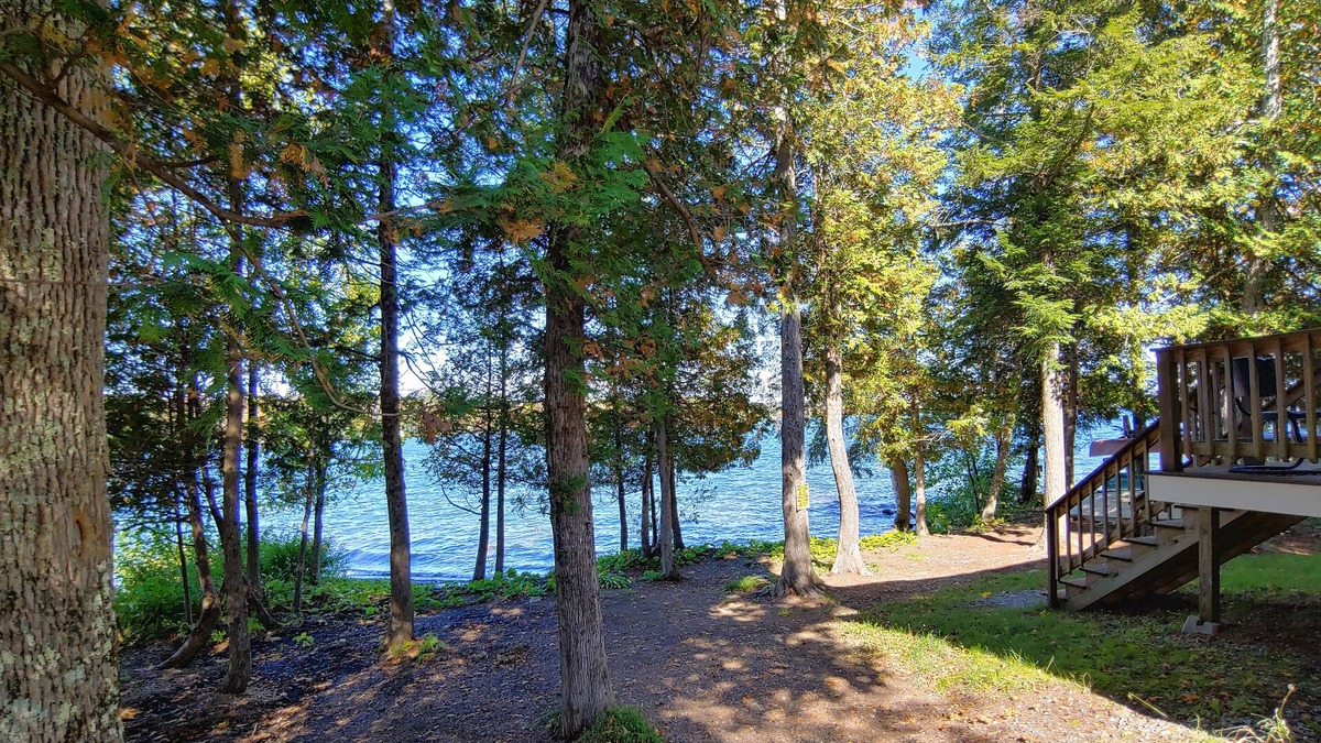 Dexter House | Cozy lakefront home w/ a firepit, outdoor shower, & private beach!