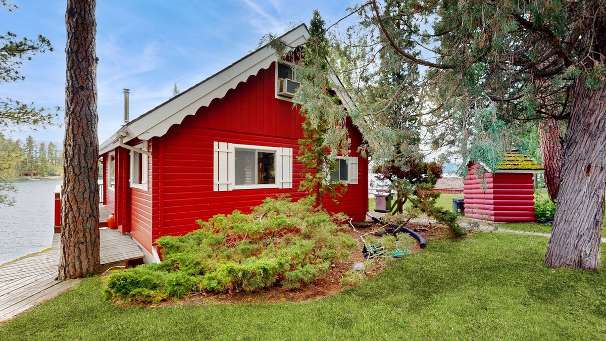 Rollins Cabin | Cozy lakefront log cabin with lake views, vintage decor, & dock