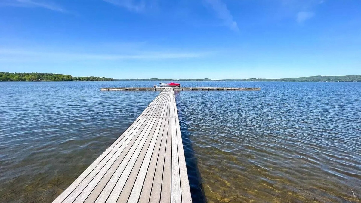 Newport Center Apartment | Cozy Lakeside Condo with a heated pool!