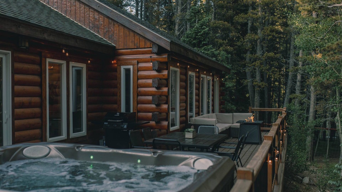 Saint Mary's Cabin | Cozy Log Cabin: hot tub under the stars, private deck, king bed, dog friendly!