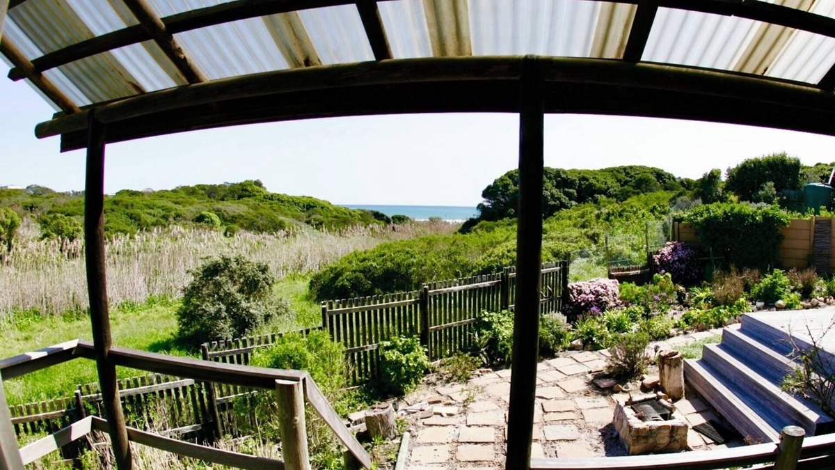 Kommetjie Apartment | Cozy Retreat: 1-Bedroom with stunning sea view down serene green belt."