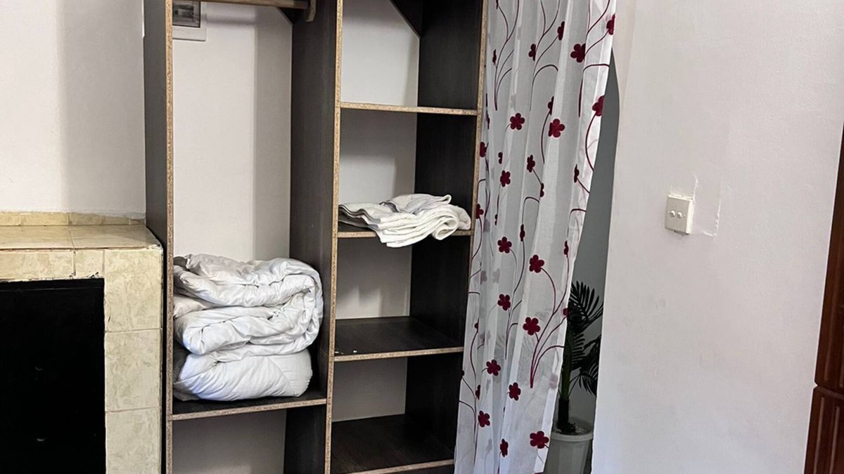 Mombasa Apartment | Cozy specious living room with a Tv for entertainment and free WiFi.