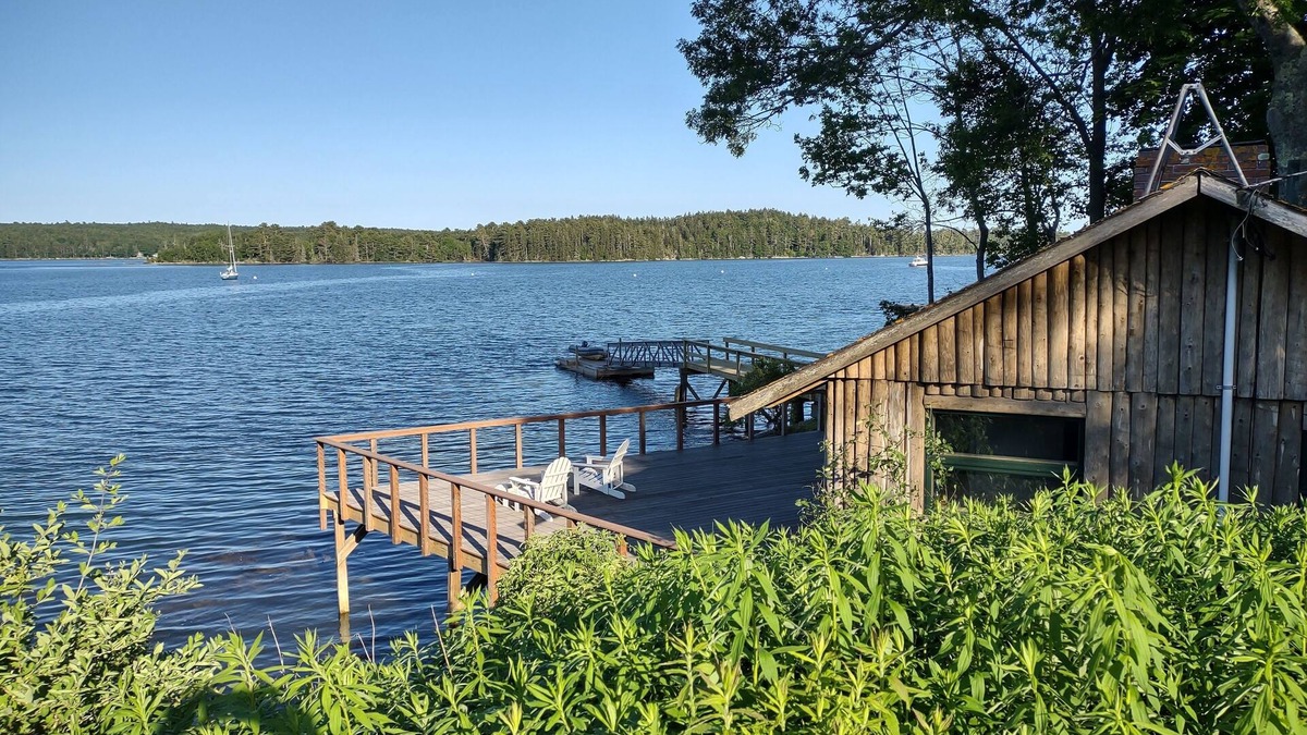 South Bristol Cabin | Cozy waterfront log cottage with huge outdoor living area.