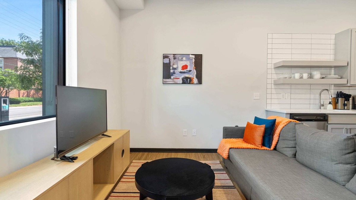 Lockerbie Square Apartment | CozySuites Mass with parking, lounge and roof deck 1