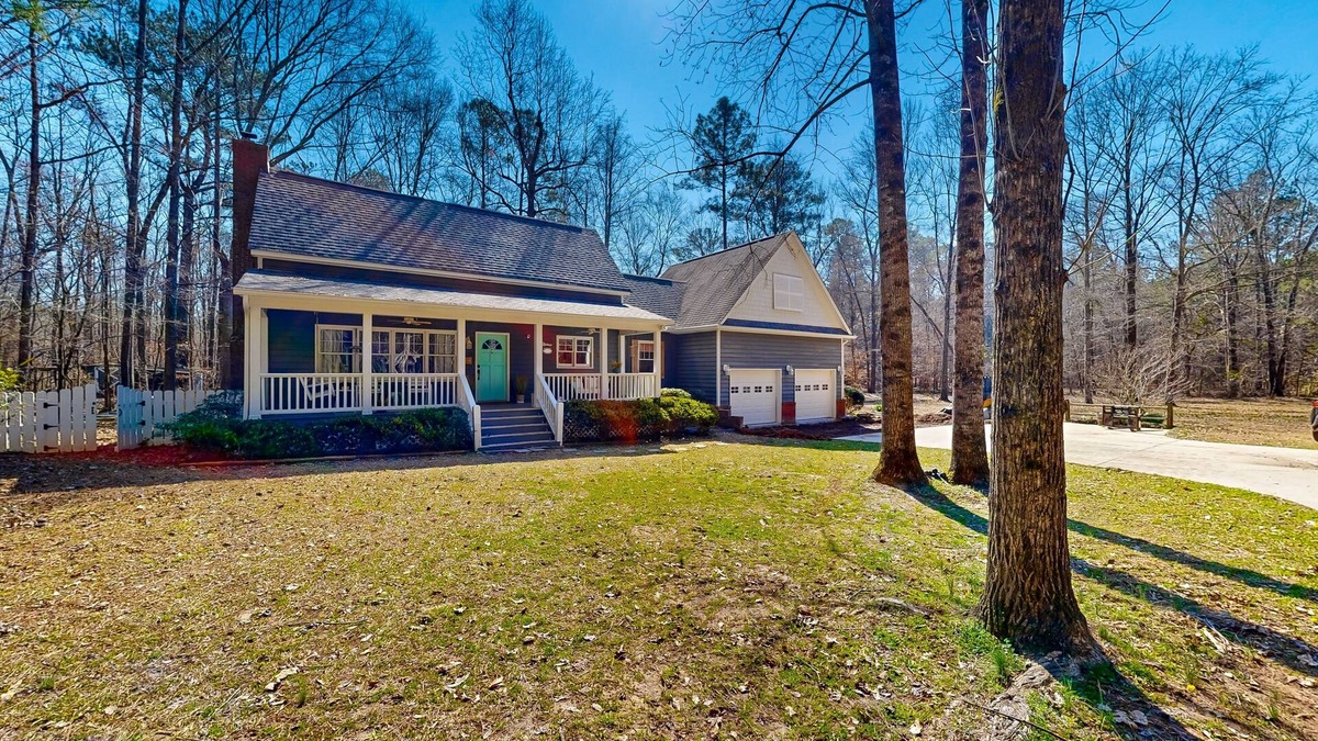Forsyth House | Creekside home with firepit, yard games, deck, wood stove, & W/D