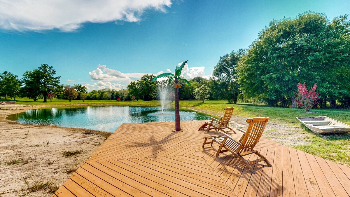 Waller House | Custom home with guesthouse, pond, sunning deck, beach & tropical bar