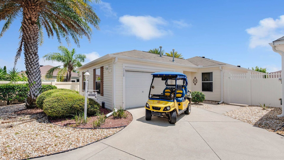 Villas of Greenwood Villa | DARLING 2 BEDROOM VILLA WITH ENCLOSED LANAI LARGE BACKYARD AND GOLF CART