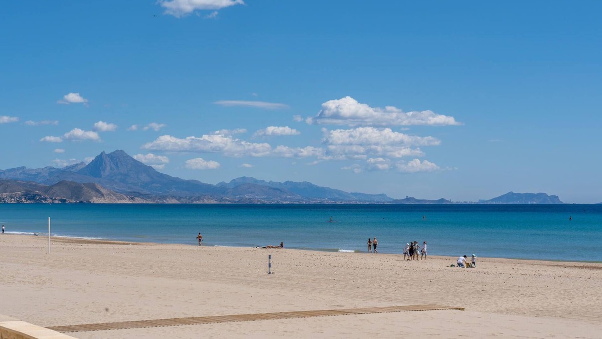 Muchamiel Apartment | Daylight friendly apartment with sea view and shared outdoor pool.