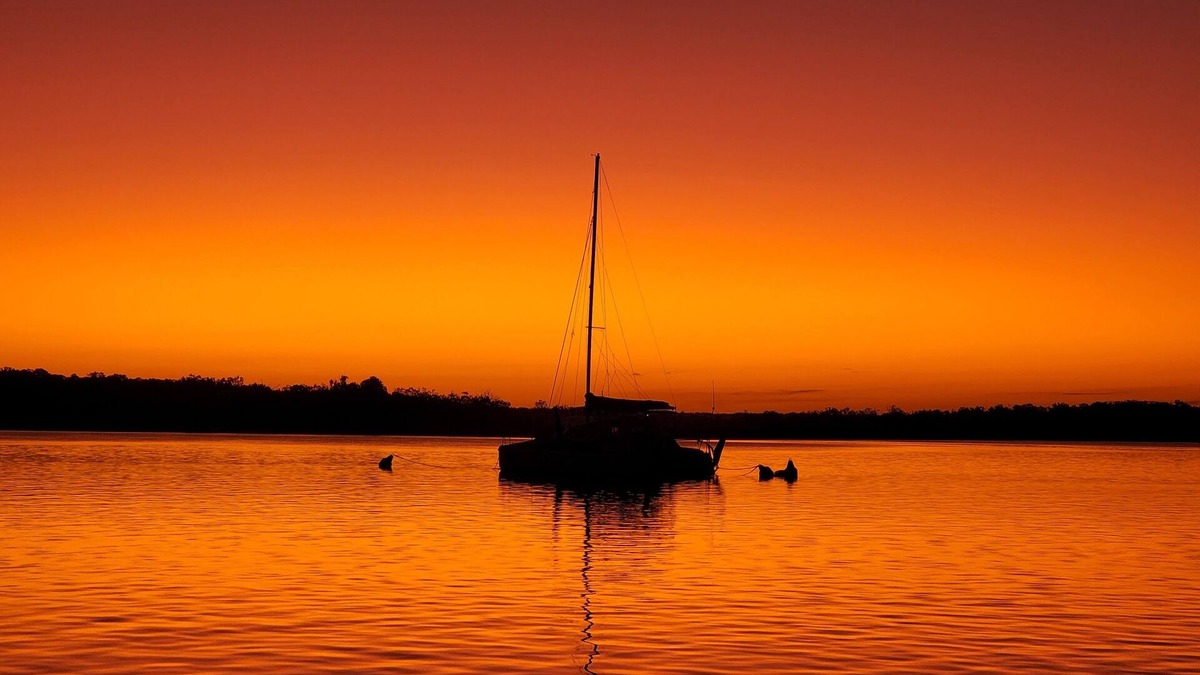 Tin Can Bay Apartment | Delightful three bedroom unit by the beach. Beautiful sunsets