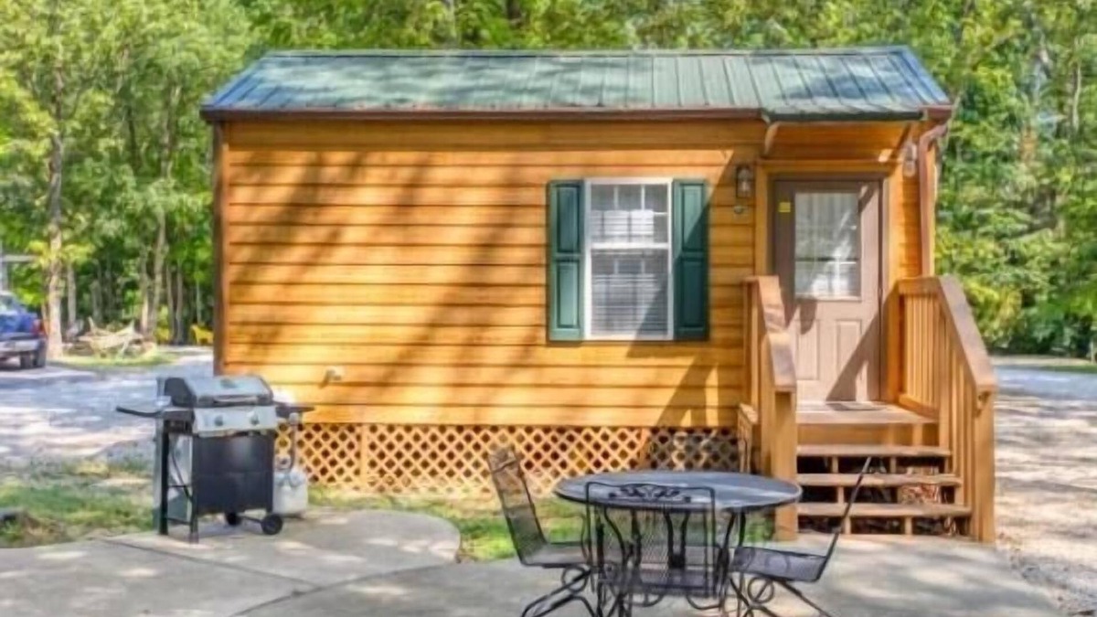 Manchester Cabin | Deluxe Cabin (w/Bathroom) - Deluxe Cabin (w/Bathroom) Better than a motel! Enjoy camping in comfort! Kitchen with stove top and full size fridge with dishes pots included. Full bathroom with shower. Cable TV DVD player. Gas grill on your own concre