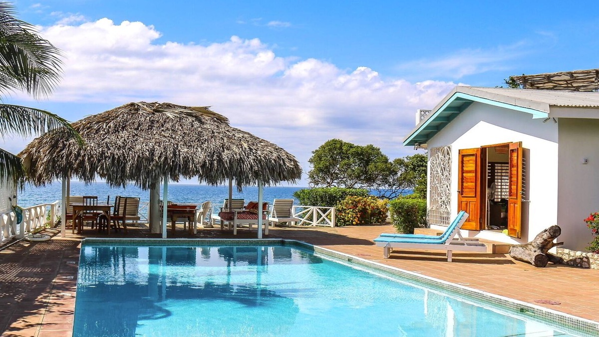 Treasure Beach Villa | Doubloon Villa, large pool and sandy beach at heart of Treasure Beach
