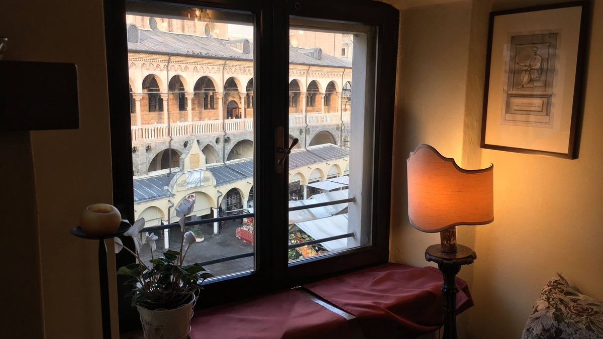 Historic Centre Apartment | Elegant two-story apartment with windows overlooking the Palace of Reason.