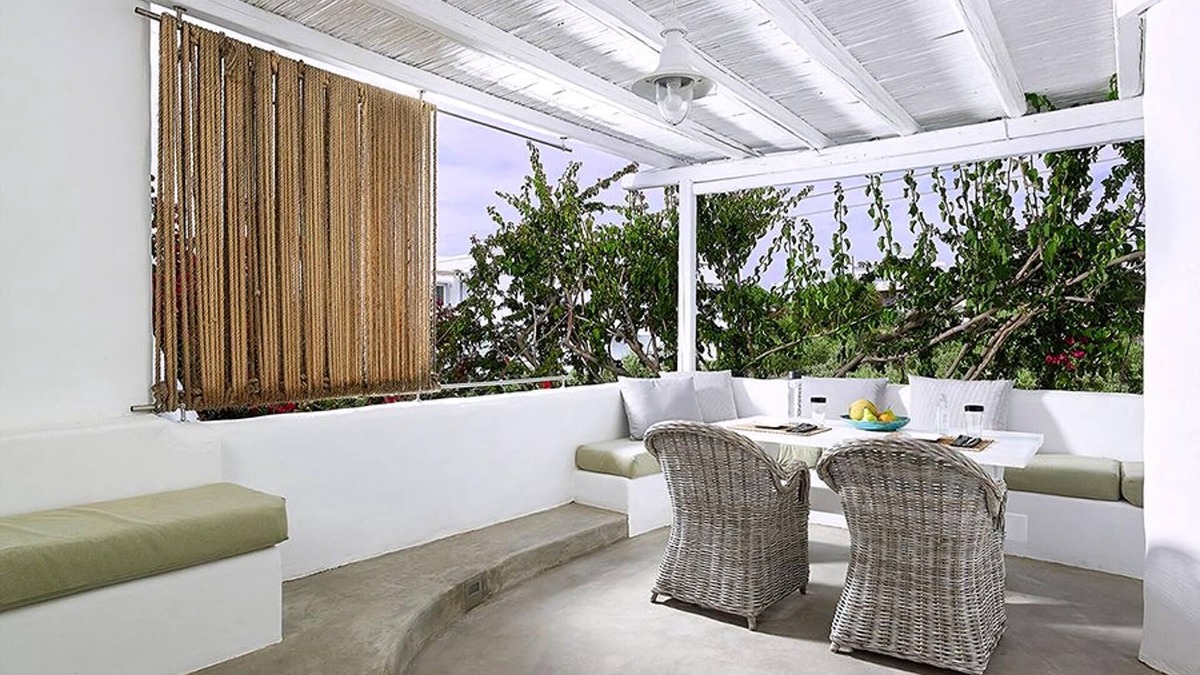 Apollonia Villa | Endearing Milos Suite | Cycladic Light Suite | Private Furnished Balcony | Outdoor Dining Area |.