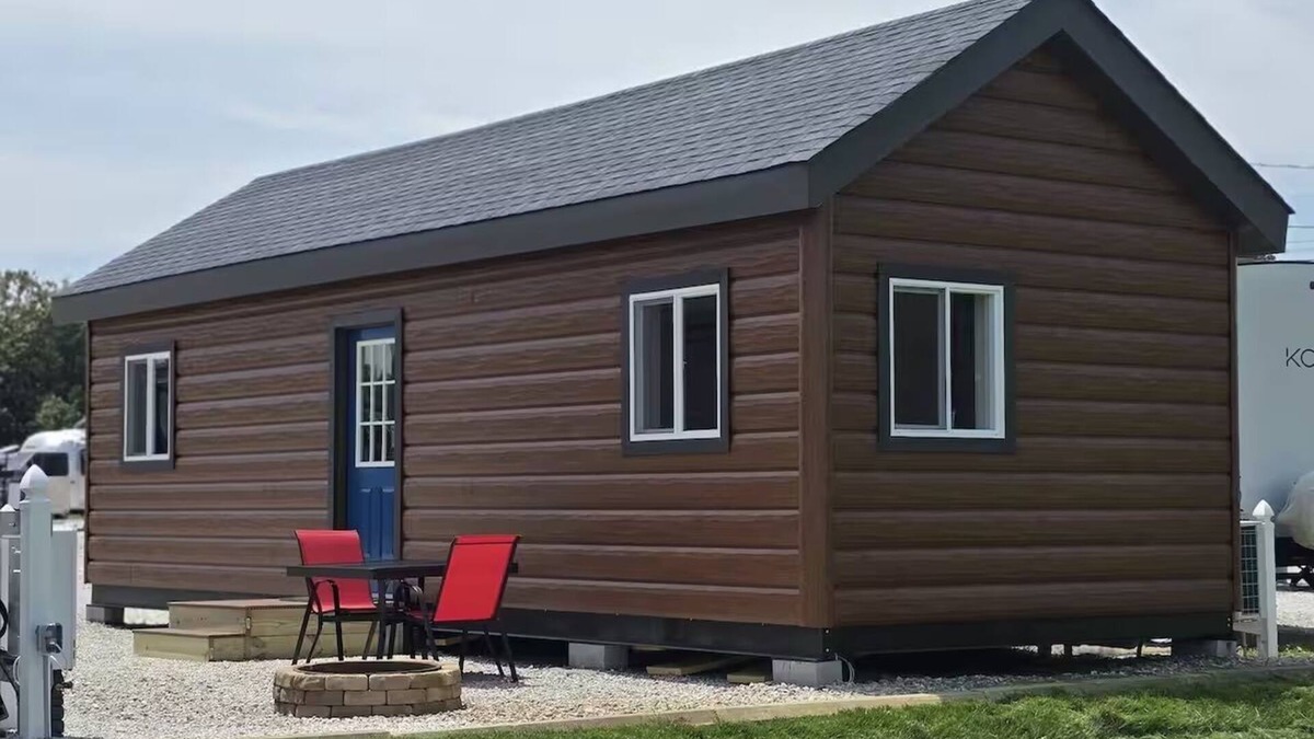 Tuscumbia Cabin | Enjoy cabin #64 at Heritage Acres Park with swimming, splash pad & more!