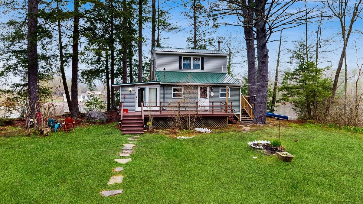 Augusta Cabin | Entire lakefront duplex on Togus Pond with decks, canoe, firepit & great view