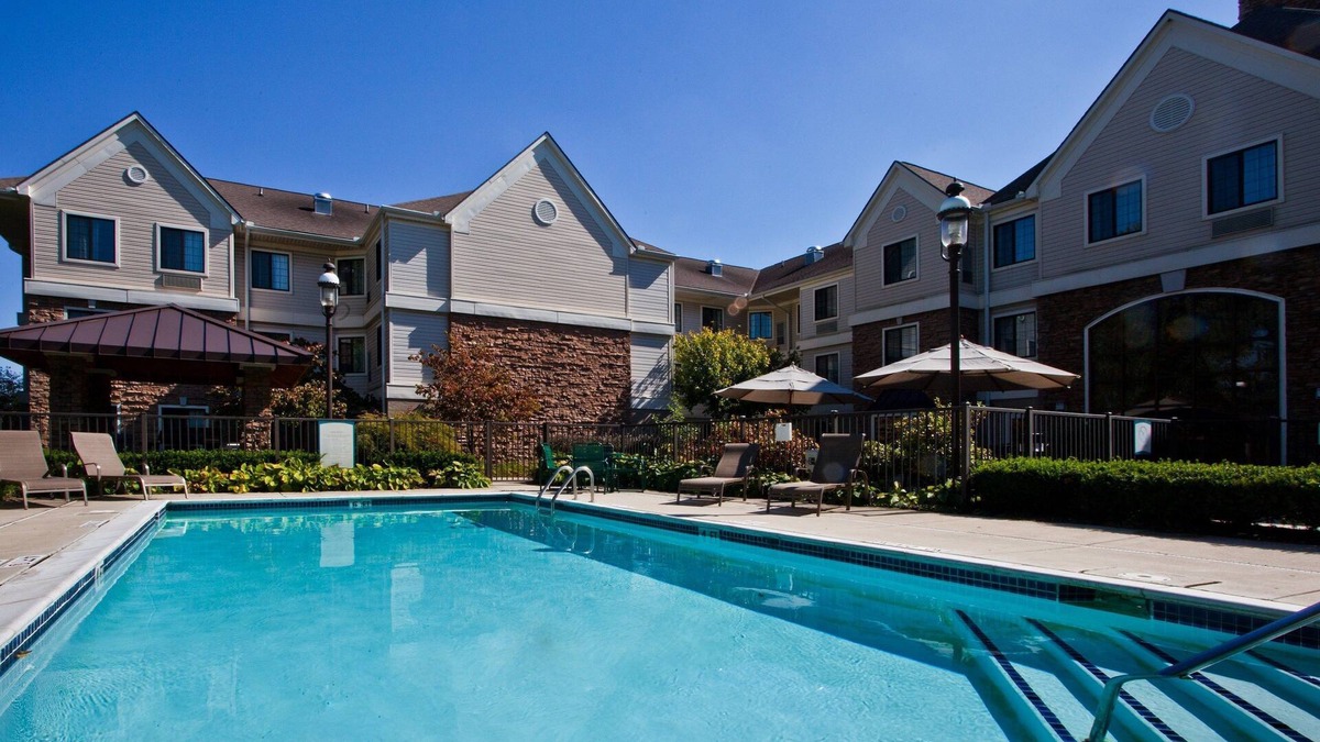 Shelby Township Apartment | Equipped Suite | Free Breakfast, 24h Business Center + Seasonal Pool