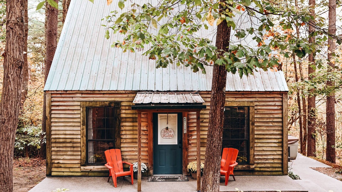 Carbon Hill Cabin | Evergreen Hideaway is a cabin nestled under tall pines.