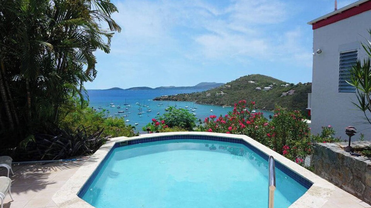 Estate Chocolate Hole and Great Cruz Bay Villa | Experience the enchanting allure of La Collina – a stunning home that boasts breathtaking sunset views & ocean views, a refreshing pool, and air conditioning. Elevate your lifestyle in this picturesque retreat!