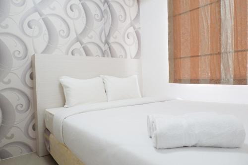 Jatinegara Apartment | Exquisite 2BR Bassura City Apartment near Shopping Mall By Travelio