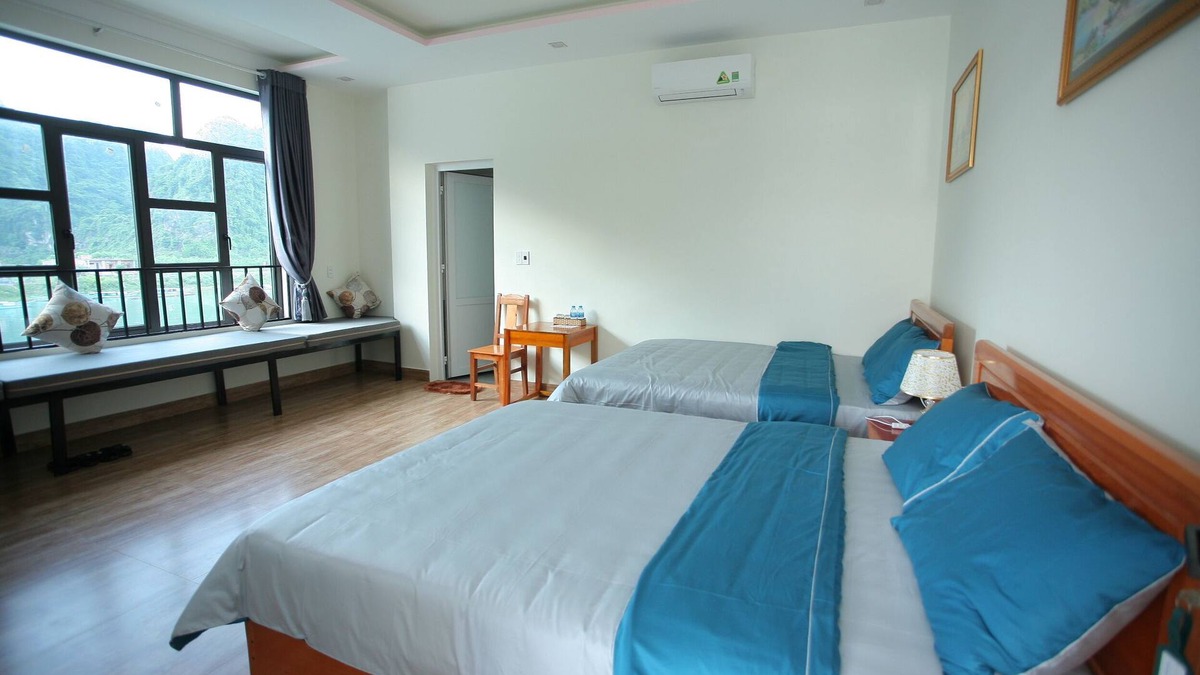 Phong Nha House | Family room with River and Mountain Views, 2 Queen Beds Funny Monkeys Homestay