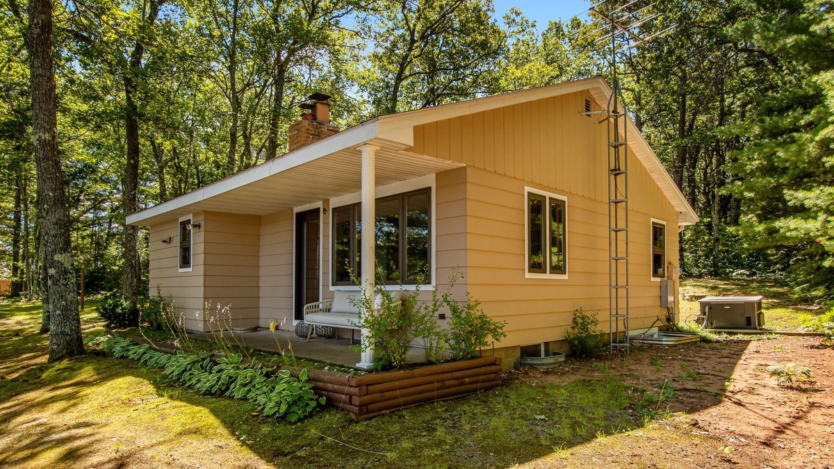 Lac du Flambeau House | Fantastic lakefront escape with dock, boat slip, fast WiFi, firepit, & gas grill