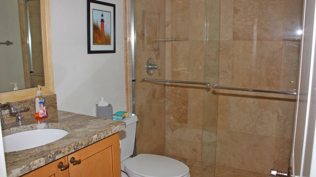 New Smyrna Beach Condo | Fantastic Oceanfront three bedroom. Travertine floors, custom kitchen and bathrooms. Luxury Condo!