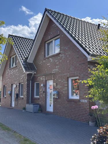 Dornum House | Feriendomizil Dornum Haus Willy mit Wintergarten und Wallbox