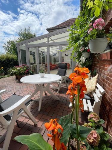 Eystrup Apartment | Ferienwohnung mit WINTERGARTEN in Bahnhofsnähe