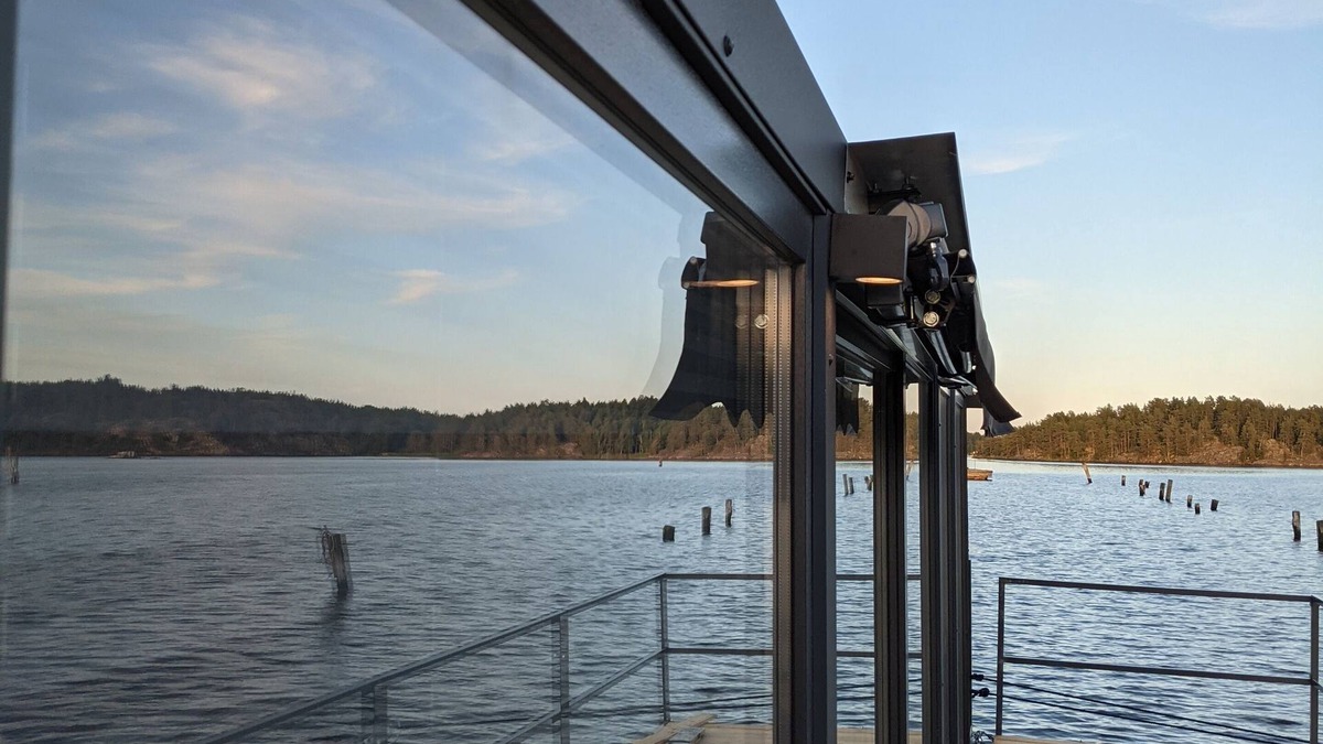 Blankaholm Boat Rental | Floating house, unobstructed view of the beautiful water with boat, Blankaholm Sweden