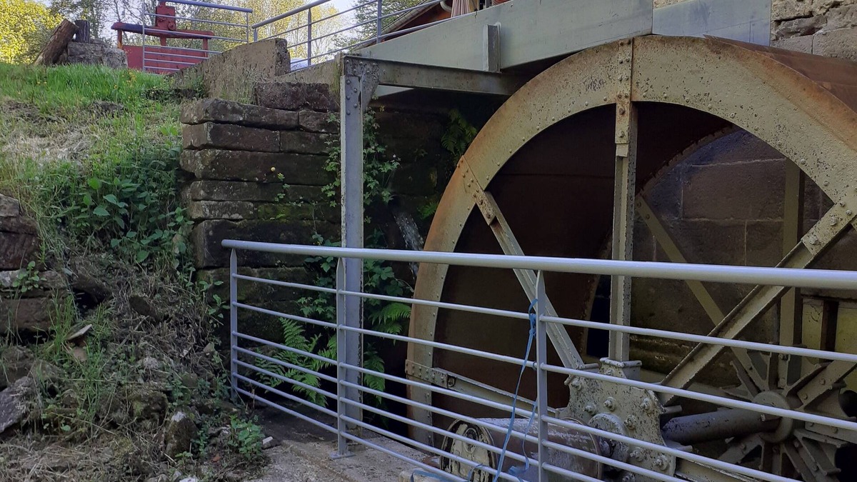 Escles House | Former flour mill with pond on wooded grounds