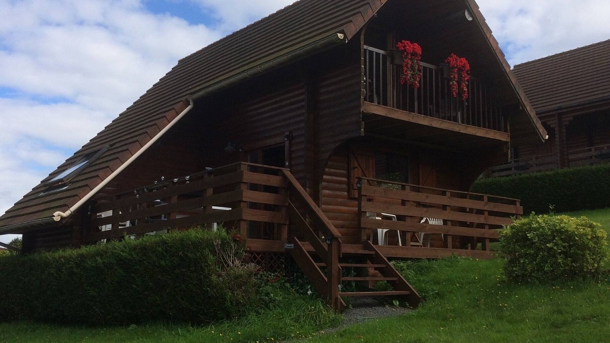 Saint-Germain-de-Tallevende-la-Lande-Vaumont Ski Chalet | Traditional Log Cabin on quiet Residential Commune overlooking Lake Dathee