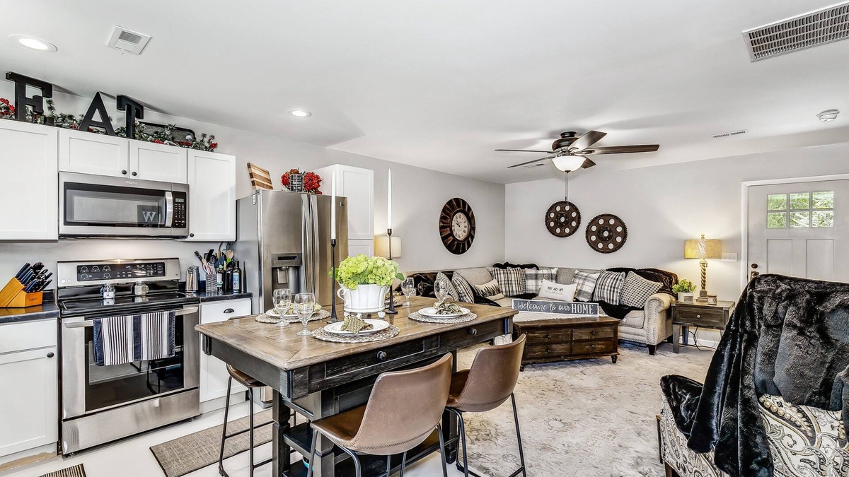 Wichita House | Front door parking, private covered patio with fenced in backyard