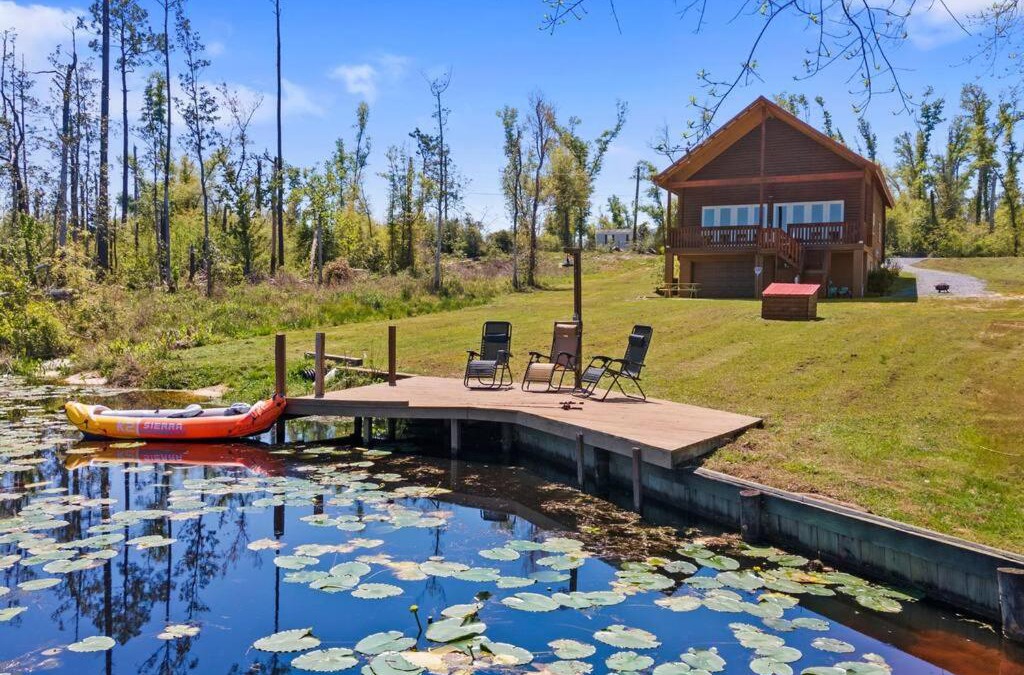 Youngstown House | Fun fishing river cabin 23mi to beach with private dock 3BD 2BA