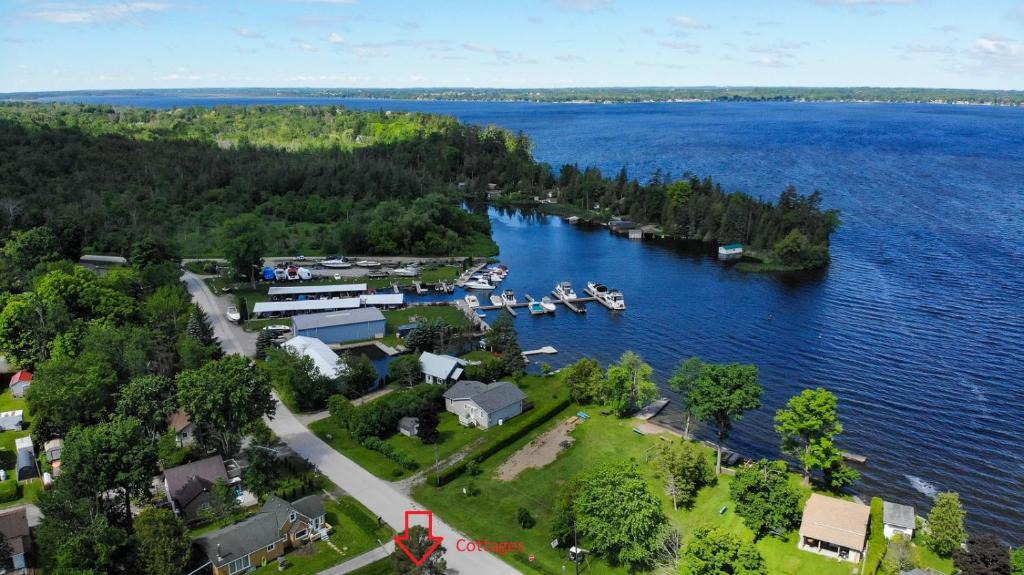 Lindsay House | Fun Place with a Sandy Beach for Swimming, Boating & Fishing, Featuring 1 House and 3 Cabins