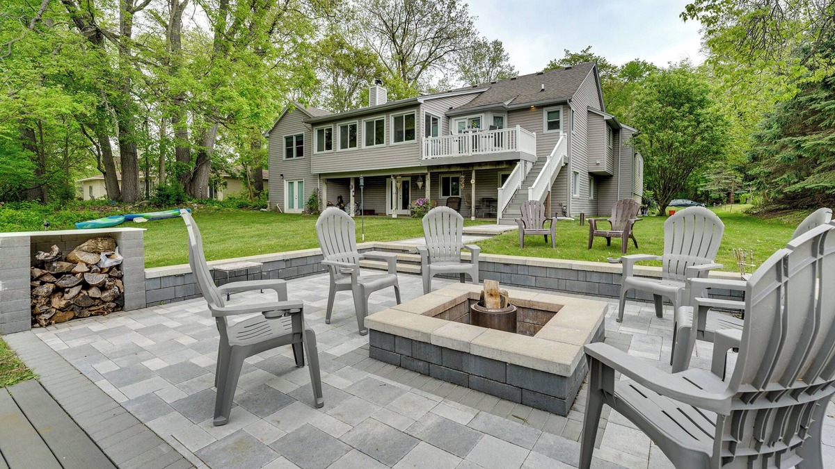 Commerce Township House | Game Room & Fire Pit: Canal-Front Commerce Home