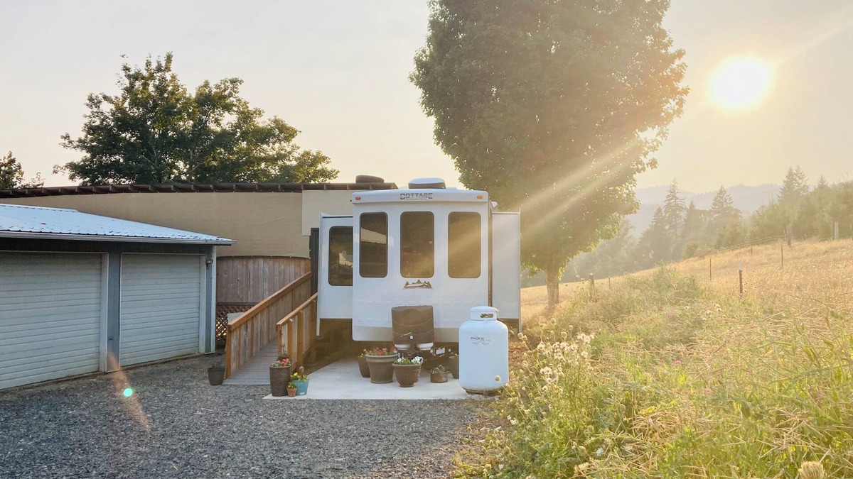 Ariel House | Glamping at Coyote Ridge! Camp out in style in a luxury cottage RV! W/firepit