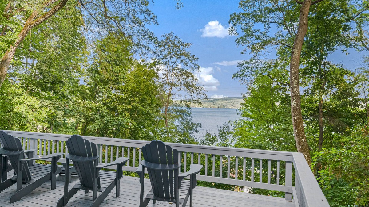 North Lake George House | Gorgeous lakeview retreat with wraparound porch, wood stove, & WiFi - dogs OK